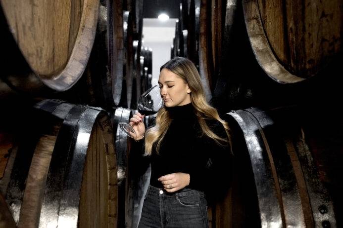 A lady Drinking a wine | The 5 Best Wineries To Visit In Virginia | Sports Car Rental near me | Capital Exotics