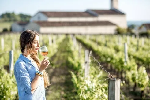 A lady enjoying her best wine in the Virginia
