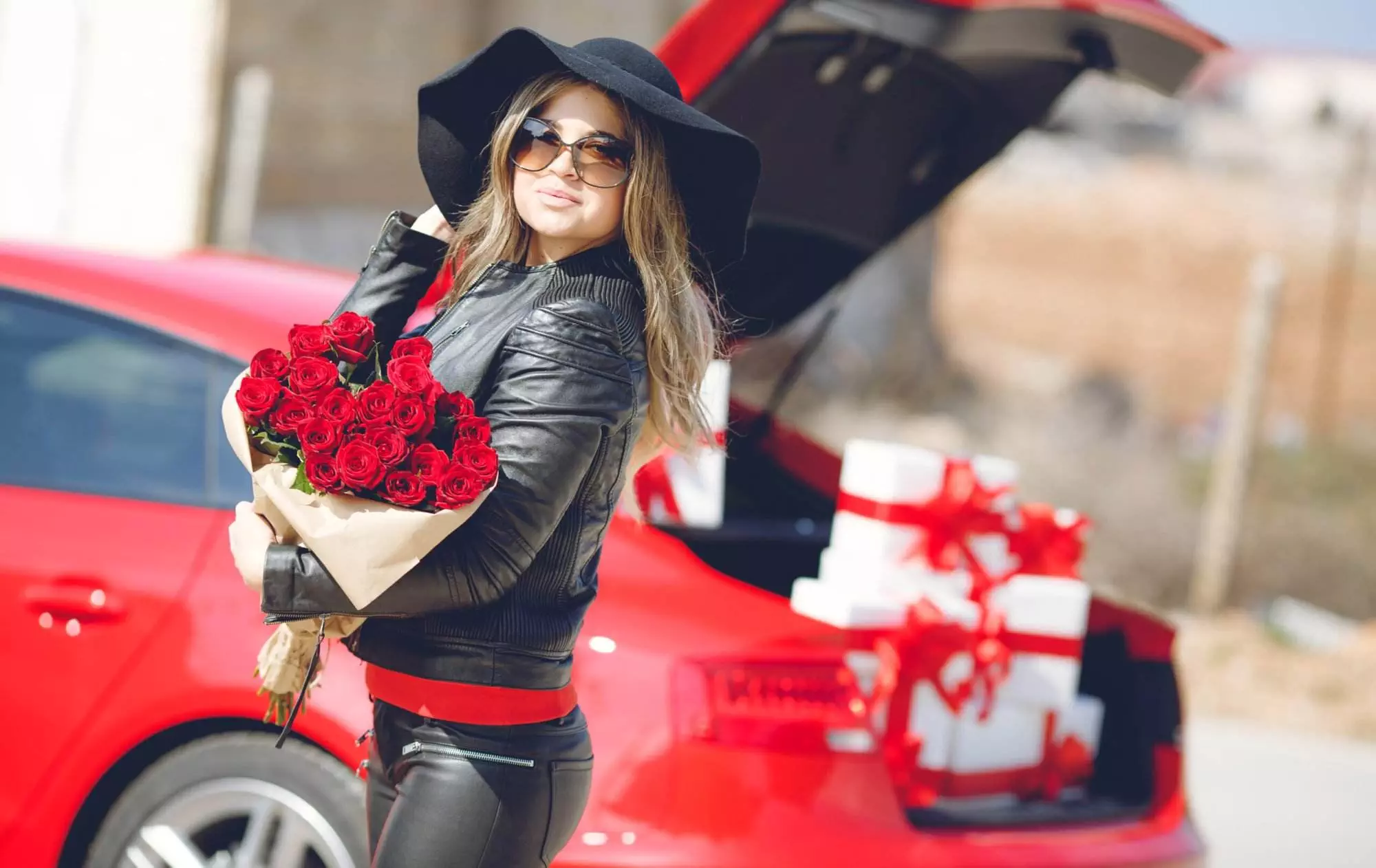 A beautiful woman enjoying an Exotic Car Rental in Valentine's day.